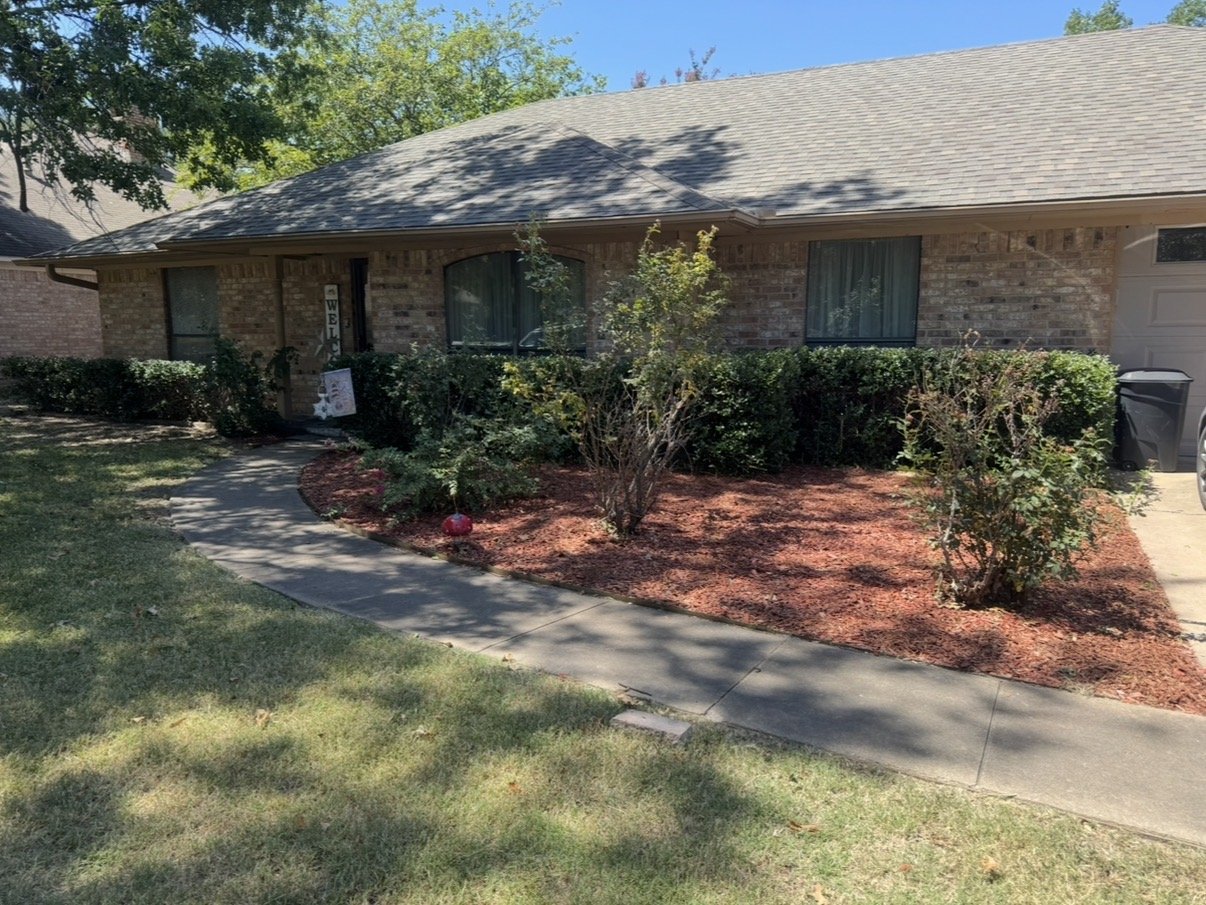 Flower bed cleaned, shrubs trimmed, and fresh mulch installed in Edmond, Oklahoma